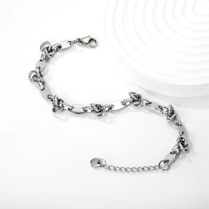 Detail of stainless steel bracelet with knot links, lobster clasp and extension chain