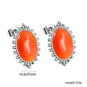 Detail view of oval cat eye stone earrings with silver beaded edges and size dimensions