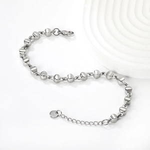 Detail of silver stainless steel bead chain with S.Steel hallmark and lobster clasp closure