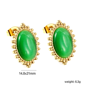 Detail of vintage gold oval stud earrings with white cat eye stone and beaded edge