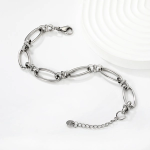 Detail of silver stainless steel link chain bracelet with lobster clasp and extension