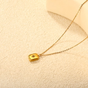 18K gold plated stainless steel necklace featuring a rectangular starburst pendant with crystal
