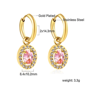 Detailed view of gold earrings with pink oval stones and size specifications