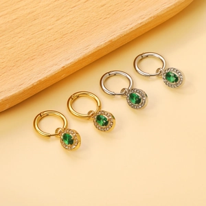 Vintage 18K gold and silver hoop earrings featuring emerald-cut zircon oval pendants