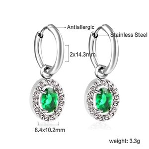 Detail of silver stainless steel earrings with oval green zircon and white crystals