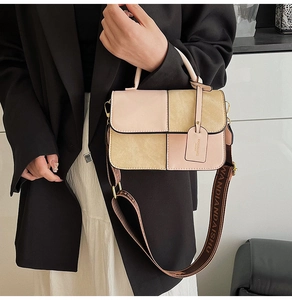 Detail of pink and khaki patchwork handbag with stylish jacquard wide shoulder strap