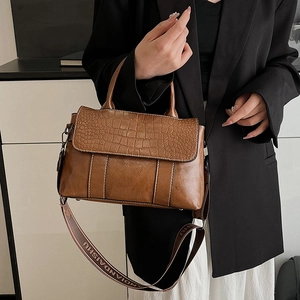 Brown crocodile texture leather tote bag with stylish wide branded crossbody strap