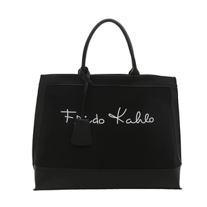 Large black canvas tote bag with Frida Kahlo signature and leather accents