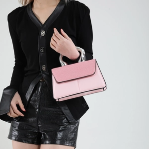 Fashionable pink square handbag with silver metal handle and textured flap cover