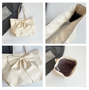 Detailansicht der cremefarbenen Shopper-Tasche mit Schleife, Reißverschluss und Innenraum