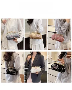 Detailed views of velvet shell bags with pearl straps and butterfly embroidery in five colors