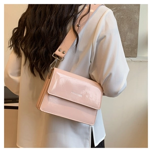 Detail of light pink patent leather mini square bag with silver fashion engraving
