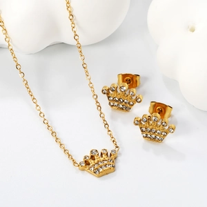 Elegant gold crown jewelry set with sparkling crystals including necklace and earrings