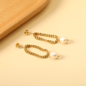 Elegant gold double beaded hoop earrings with white pearls in a minimalist retro style