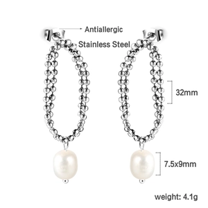 Macro detail of antiallergic stainless steel earrings with teardrop pearls and bead chains