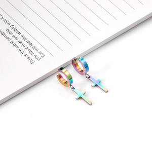 Macro detail of rainbow iridescent stainless steel cross earrings with hoop closure