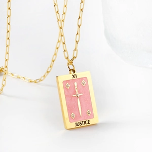 Gold rectangular Justice Tarot card necklace with pink glitter and sword pendant detail