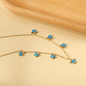 Collana in oro 18K con ciondoli corona in smalto blu e pietre di zirconia