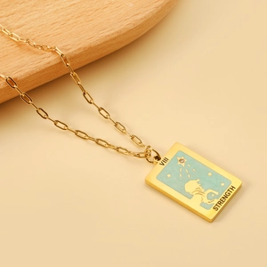 Close-up of gold tarot strength pendant featuring a lion and light blue enamel detail