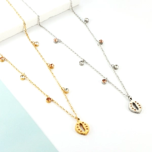 Bohemian gold and silver necklace with eye pendant and round diamonds on light background