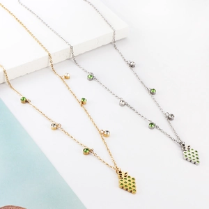 Exquisite gold and silver grape pendant necklaces with green gemstones and accent stones