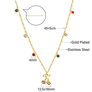 Detail of gold plated stainless steel cherry necklace with colored cubic zirconia crystals