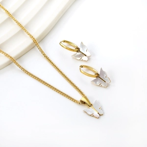 Elegant gold butterfly jewelry set featuring white shell pendants with necklace and earrings