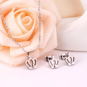 Detail showing crown and cross pendant with zircon stones and matching stud earrings