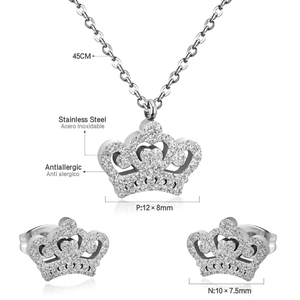Detailed view of stainless steel crown necklace and earrings set with crystal inlay