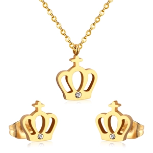 Luxurious gold crown jewelry set with necklace and stud earrings featuring white crystals