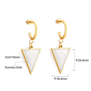 Detail view of gold-plated triangle earrings with white shell inlay and size measurements