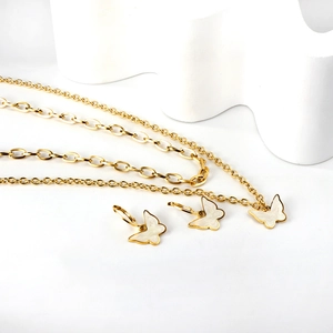 Golden butterfly jewelry set with double layered necklace and white shell earrings