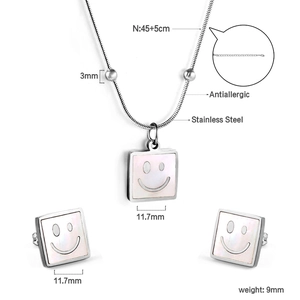 Detailed view of square white shell necklace and earrings set with dimension markings