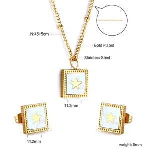 Macro detail of gold plated square shell necklace and star earrings set with measurements
