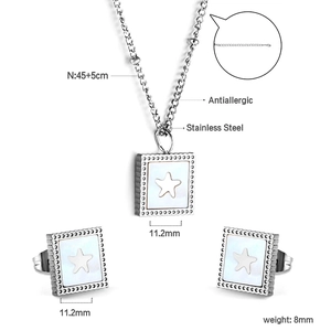 Detail view of square white shell necklace and star earrings with technical measurements