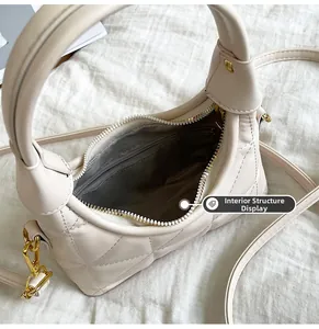 Detailed interior view showing quilted bag lining and secure zipper pocket