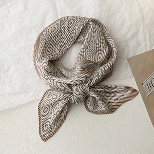 Pleated skinny silk scarf with geometric maze pattern in elegant brown and cream