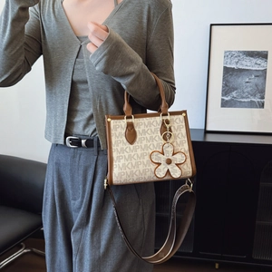 Chic Monogram printed tote bag with broad strap and floral charm accessory