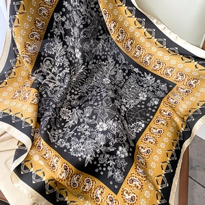 Detailed view of paisley patterns and floral motifs on a silky 70x70 square scarf