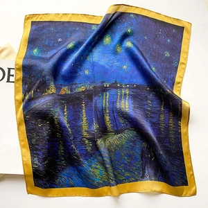 Macro shot of Starry Night print silk scarf with luxury glossy yellow satin border
