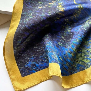 Close-up of Van Gogh Starry Night print silk scarf with golden satin piped edges
