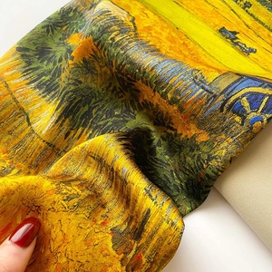 Detailed close-up of Van Gogh oil painting silk scarf with yellow harvest print and twill texture
