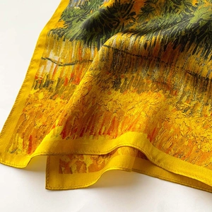 Detail of oil painting floral silk scarf with fine rolled hem and artistic texture