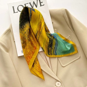 Detail of oil painting silk scarf with Van Gogh harvest pattern on beige blazer