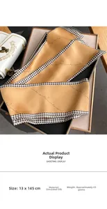 Detail of 13x145cm yellow imitation silk scarf with houndstooth edge and script print