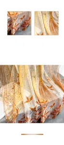 Detailed macro view showing the plant-dyed autumn leaf pattern on a soft silk scarf