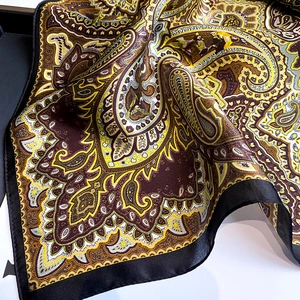Close-up of vintage mulberry silk scarf with yellow and brown paisley patterns