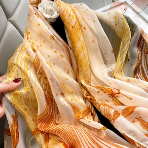 Elegant long silk scarf with orange feather print and lightweight summer sunscreen shawl