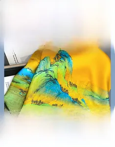 Detail showing the intricate landscape painting print on ginger yellow silk fabric texture