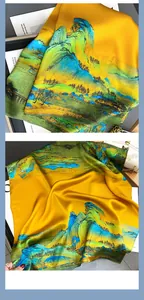 Macro detail of silk scarf showing vibrant landscape print and refined rolled hem edges
